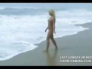 Nude blonde babe walks on the beach and then gets hammered