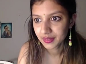 Cute tattooed girl posing for webcam video